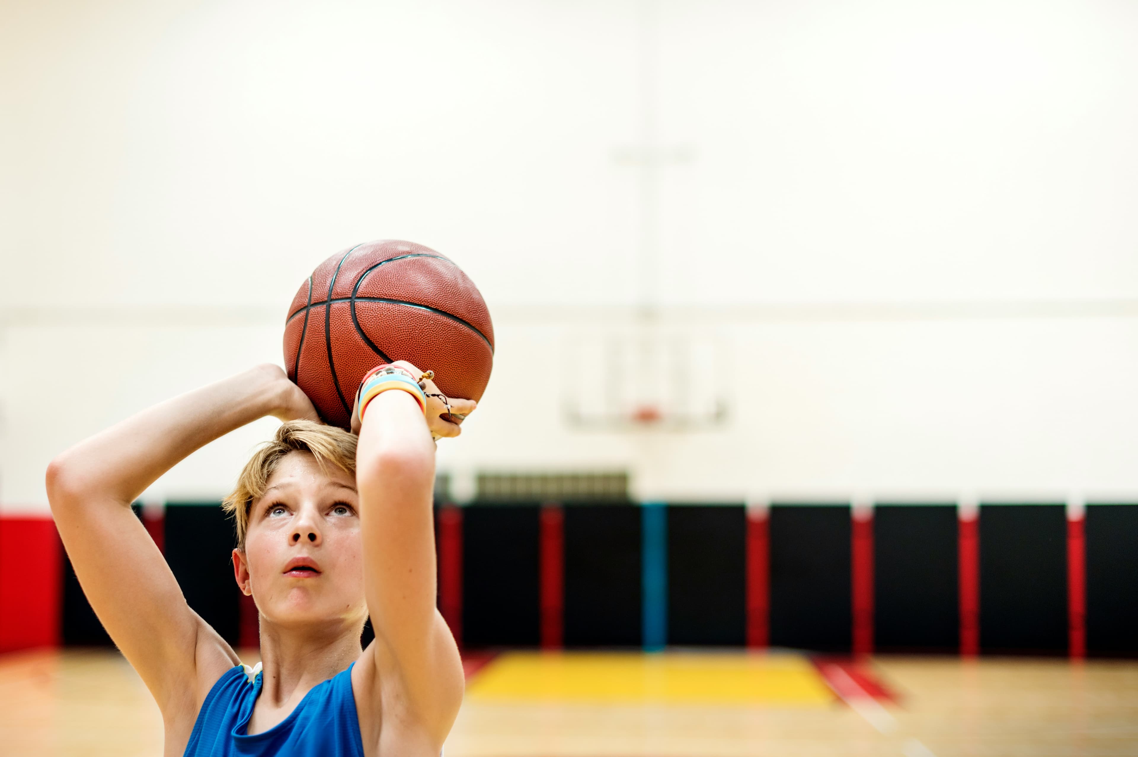 Young basketball players practicing shooting in Edmonton